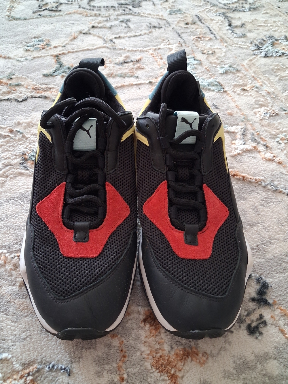 Puma Men’s Black Athletic Sneakers with Red and Yellow Accents